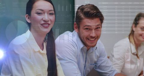 Happy Business Team Engaging in Data Analysis Meeting