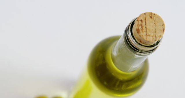 Green Glass Bottled Olive Oil with Cork Stopper on White Background - Download Free Stock Images Pikwizard.com