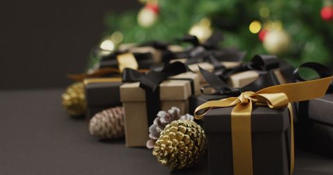 Elegant Christmas Gifts with Pine Cones and Black Background - Download Free Stock Images Pikwizard.com