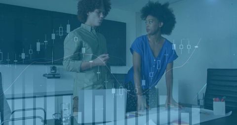 Business Professionals Analyzing Data with Overlay Charts in Modern Office