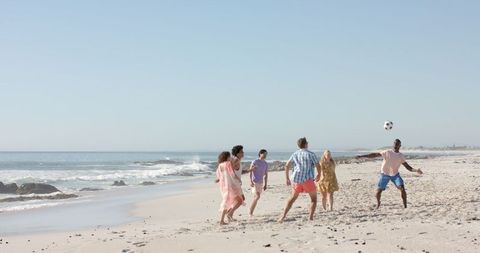 Friends Playing Soccer on Sunny Beach Creating Lasting Memories - Download Free Stock Images Pikwizard.com