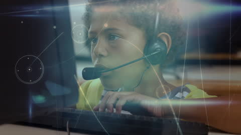 Student Using Computer with Headset and Digital Graphics