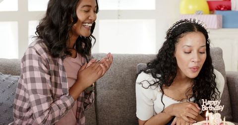 Joyful Birthday Celebration with Cake and Friends on Couch