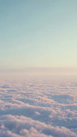 Vertical drone footage drifting clouds at sunrise with pastel sky and sparkling atmosphere