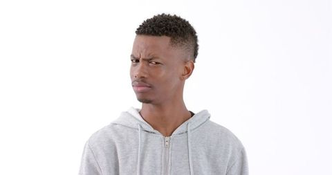 Young Man in Hoodie Expressing Confusion - Download Free Stock Images Pikwizard.com