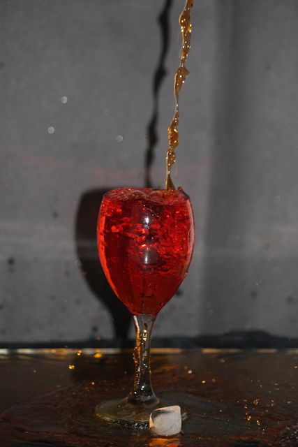 Red Cocktail Drink Splashes in Tall Glass with Ice - Download Free Stock Images Pikwizard.com