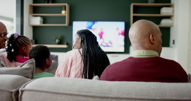 Family Watching Television Together on Sofa at Home - Download Free Stock Images Pikwizard.com