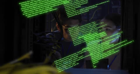 IT Engineers Analyzing Data Code in Server Room