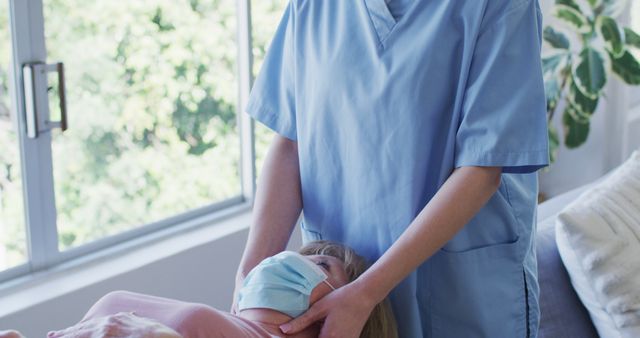 Chiropractor providing spinal adjustment for female patient in modern healthcare clinic. Suitable for use in advertisements, websites, or educational materials related to medical treatments, physical therapy, chiropractic care, and rehabilitation.