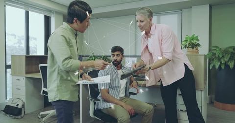 Collaborative Office Team Meeting with Digital Data Integration