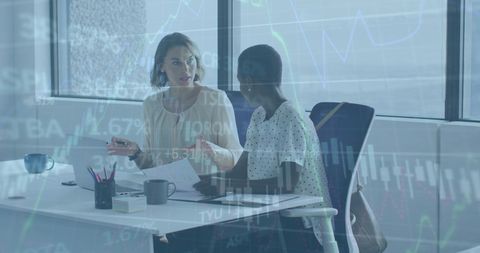 Diverse Coworkers Analyzing Stock Market Reports with Technology Overlay