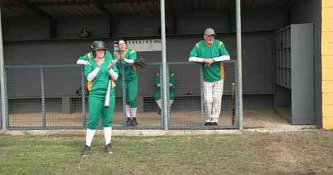 Dugout Cheer: Female Baseball Player Applauding Teammates