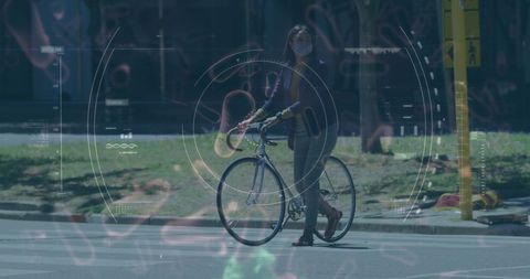 Urban Cyclist Walking Bicycle with Futuristic Graphic Overlay