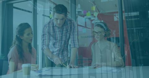 Team Analyzing Data with Innovative Interface Overlay in Modern Office