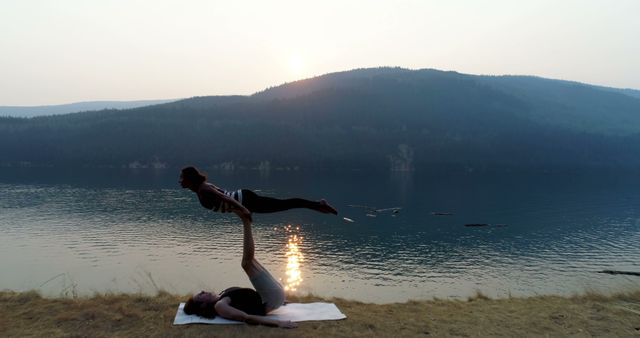 Couple Practicing Acro Yoga by Serene Mountain Lake at Sunset - Download Free Stock Images Pikwizard.com