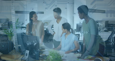 Diverse Colleagues Collaborating in Tech-Driven Office Environment