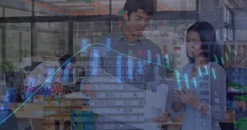 Business Professionals Analyzing Financial Data with Digital Graph Overlay