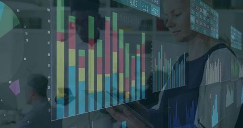 Business Professionals Analyzing Data on Digital Display in Office Environment