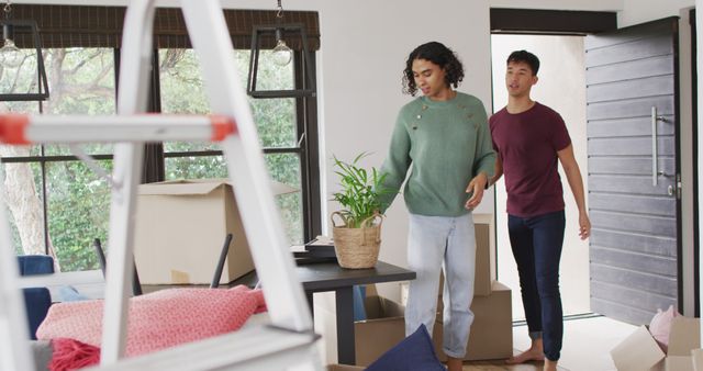 Young Couple Moving into New Home with Boxes and Ladder - Download Free Stock Images Pikwizard.com