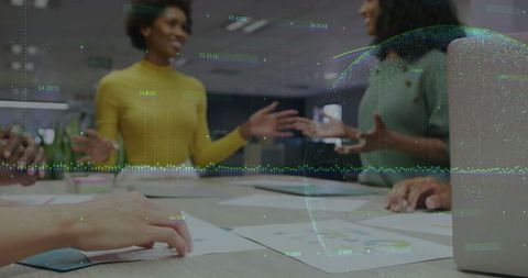 Diverse Team Collaborating on Data-Driven Strategy in Modern Office