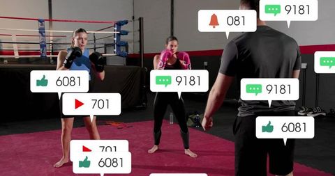 Boxing coach guiding two female fighters during live-stream training with social badges