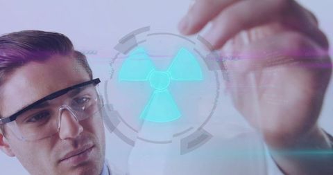 Laboratory researcher examining holographic radiation symbol on transparent display