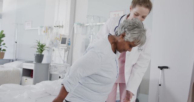 Female Doctor Assisting Senior Patient in Hospital Ward - Download Free Stock Images Pikwizard.com