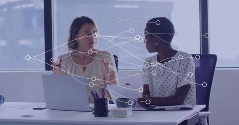 Diverse Businesswomen Collaborating with Digital Network Interface