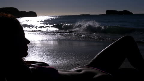 Silhouette of Woman, Evening Beach Relaxation Scene