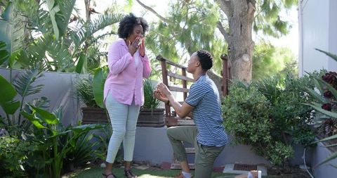 Surprise garden proposal moment captured in lush greenery