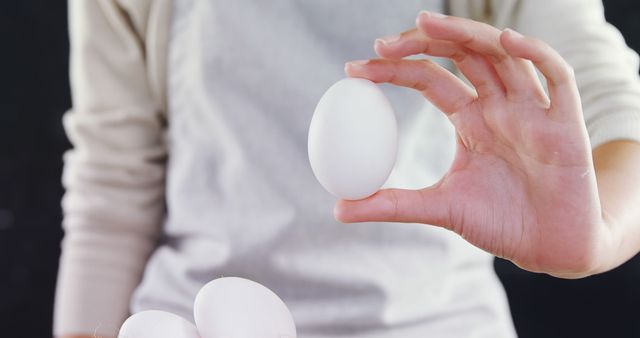 Chef Holding Egg for Cooking in Kitchen - Download Free Stock Images Pikwizard.com