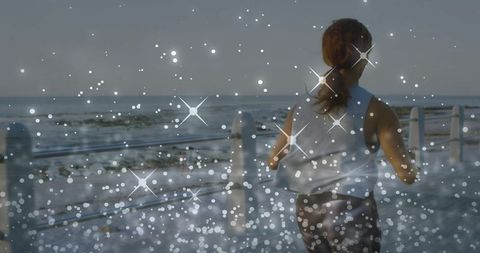 Jogging Along Coastal Promenade with Sparkling Bokeh and Open Horizon