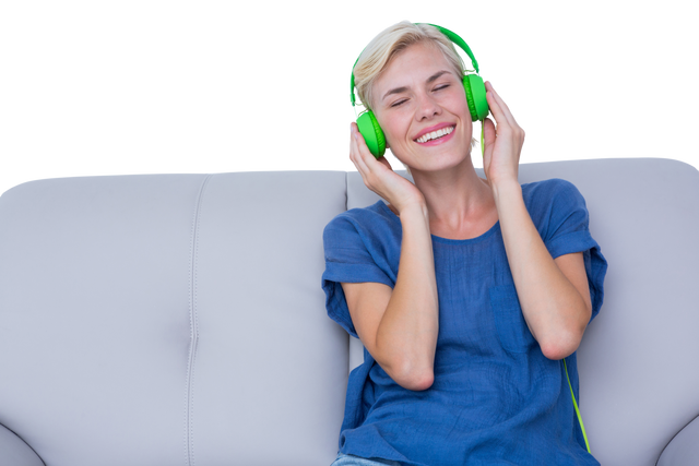 Happy Woman Enjoying Music on Couch with Green Headphones, Transparent Background - Download Free Stock Videos Pikwizard.com