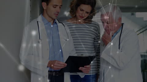 Doctors Consulting Patient with Digital Connections Overlay