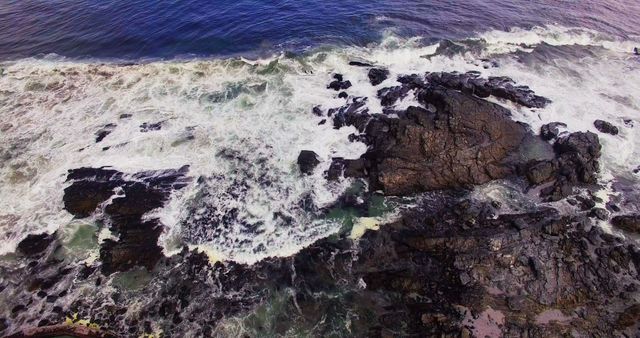 Aerial View of Rugged Rocky Coastline and Waves Crashing - Download Free Stock Images Pikwizard.com