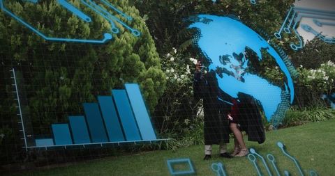 Graduation couple posing in garden, holding smartphone and bouquet with ar data overlay