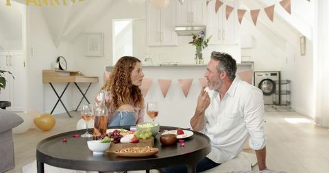 Mature Couple Enjoying Romantic Anniversary Celebration at Home