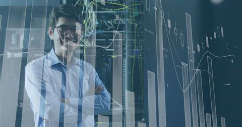 Smiling IT Engineer in Data-Centric Setting with Servers and Charts Overlay - Download Free Stock Images Pikwizard.com