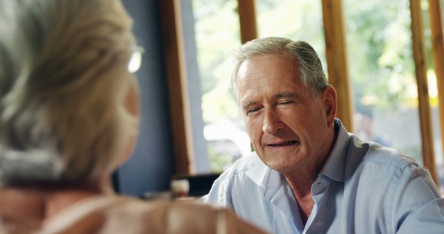 Senior Couple Having Conversation in Cozy Cafe - Download Free Stock Images Pikwizard.com