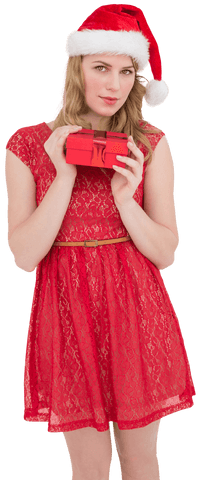Festive woman in red dress holding gift with santa hat