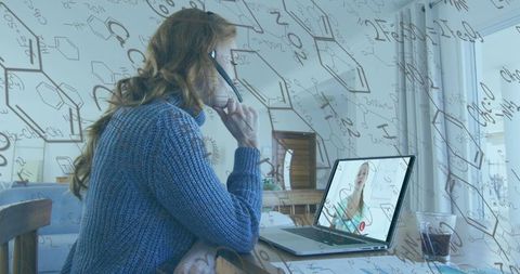 Woman engaged in online meeting with chemistry overlay