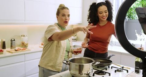 Diverse Female Friends Filming Cooking Tutorial with Ring Light