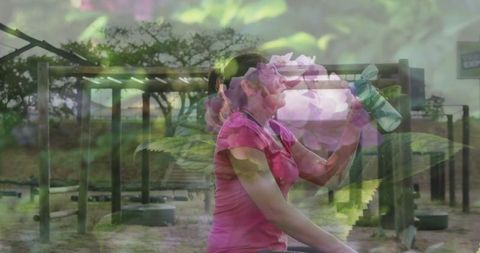 Woman in Pink Shirt Hydrating at Obstacle Course