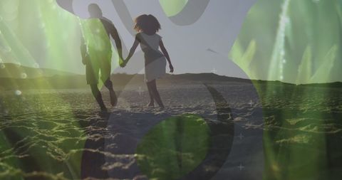 Romantic Couple Walking at Sunset on Beach