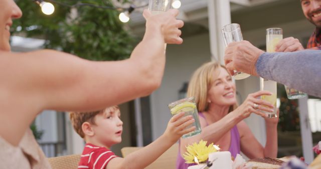 Family Cheers During Outdoor Summer Meal Gathering - Download Free Stock Images Pikwizard.com