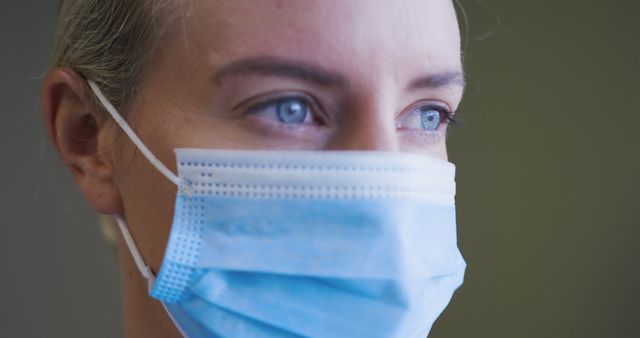 Portrait of caucasian female doctor wearing face mask looking to camera - Download Free Stock Photos Pikwizard.com