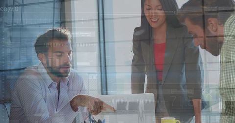 Team collaborating with digital financial interface in office