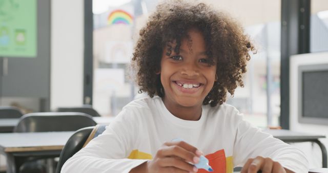 Smiling African-American Boy Having Fun in the Classroom - Download Free Stock Images Pikwizard.com