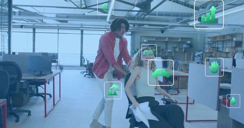 Team playful collaboration in open-plan office with ar data overlays and eco analytics