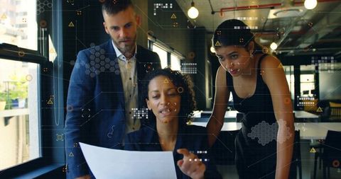 Professional team analyzing data in modern office setting